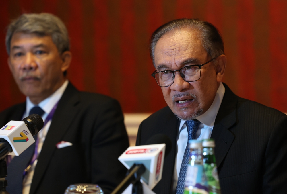 Prime Minister Datuk Seri Anwar Ibrahim speaks at a press conference after his three-day official visit to Qatar, May 14, 2024. Earlier, the prime minister said there was ‘no shred of evidence ever’ on the ship-to-ship transshipment of sanctioned Iranian oil off Malaysian waters. — Bernama pic 
