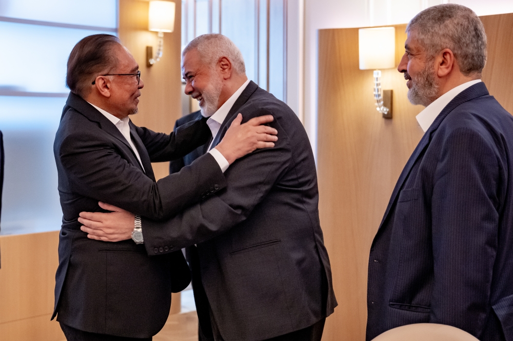 Prime Minister Datuk Seri Anwar Ibrahim meets with Hamas’ top political leader, Ismail Haniyeh, at a hotel in Doha, May 14, 2024. — Bernama pic 