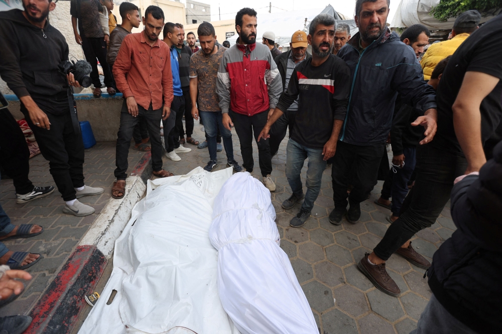 The ministry said that as of April 30 it had fully identified nearly 25,000 of those killed. — Reuters pic 