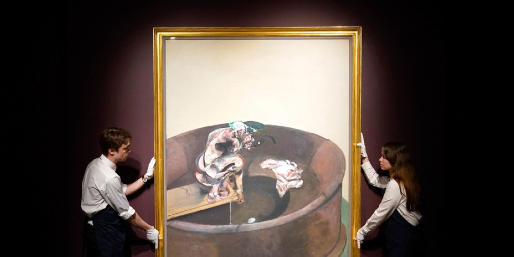 Sotheby’s art handlers hold Francis Bacon’s ‘Portrait of George Dyer Crouching’ during a media preview for Sotheby’s New York Marquee Evening Sales on May 3, 2024, in New York City. — AFP pic