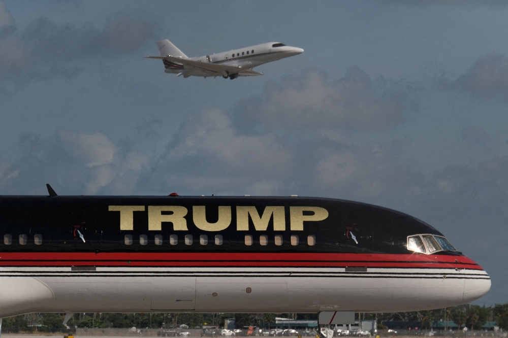 Former US President Donald Trump’s private Boeing 757 clipped another corporate jet while taxiing at West Palm Beach International Airport in Florida on Sunday. — Reuters pic