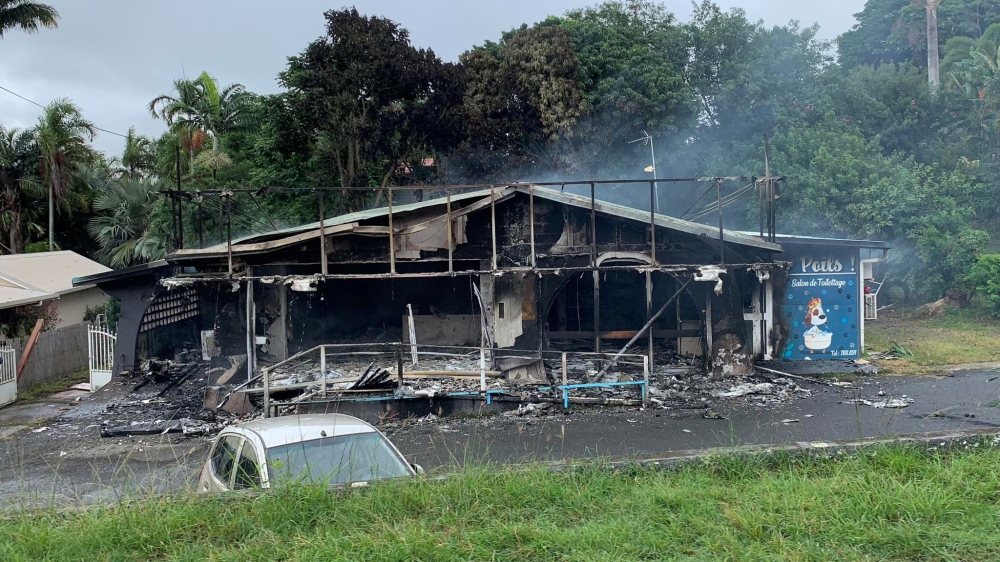 A damaged building is seen as rioters protest plans to allow more people to take part in local elections in the French-ruled territory, which indigenous Kanak protesters reject, in Noumea, New Caledonia, May 15, 2024. — Reuters pic/Lilou Garrido Navarro Kherachi