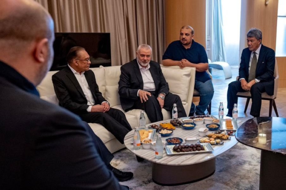 Prime Minister Datuk Seri Anwar Ibrahim meets with Hamas’ top political leader, Ismail Haniyeh, at a hotel in Doha, May 14, 2024. — Picture from Twitter/Anwar Ibrahim 