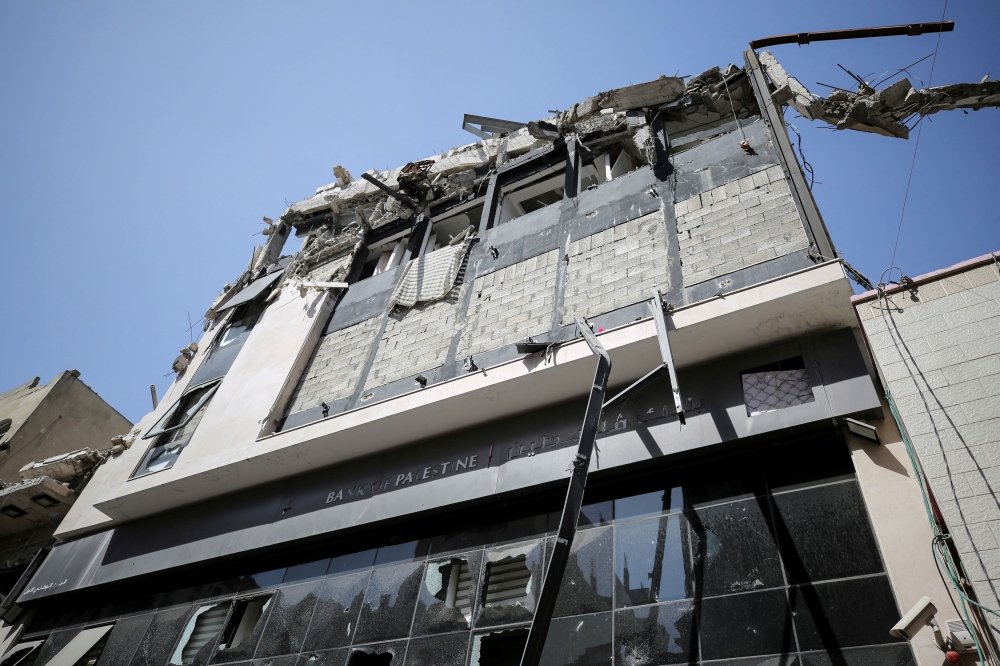 The exterior of a branch of Bank of Palestine, which was damaged in an Israeli strike, is seen amid a cash crunch caused by the destruction and closure of banks, as conflict between Israel and Hamas continues, in Gaza City May 5, 2024. — Reuters pic