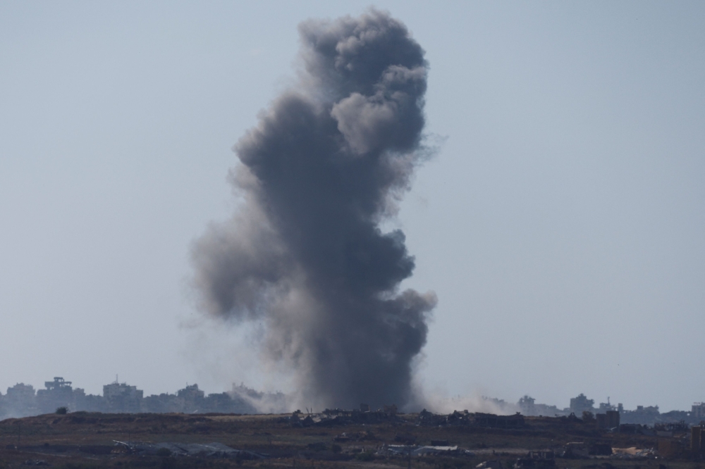 Smoke rises from an explosion following an Israeli airstrike in northern Gaza, near the Israel-Gaza border, amid the ongoing conflict between Israel and the Palestinian Islamist group Hamas, as seen from Israel, May 15, 2024. — Reuters pic
