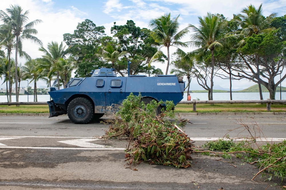 France ordered troops to guard ports and the international airport in its Pacific territory of New Caledonia as a state of emergency starting today after two nights of riots left four dead and hundreds wounded. — AFP pic