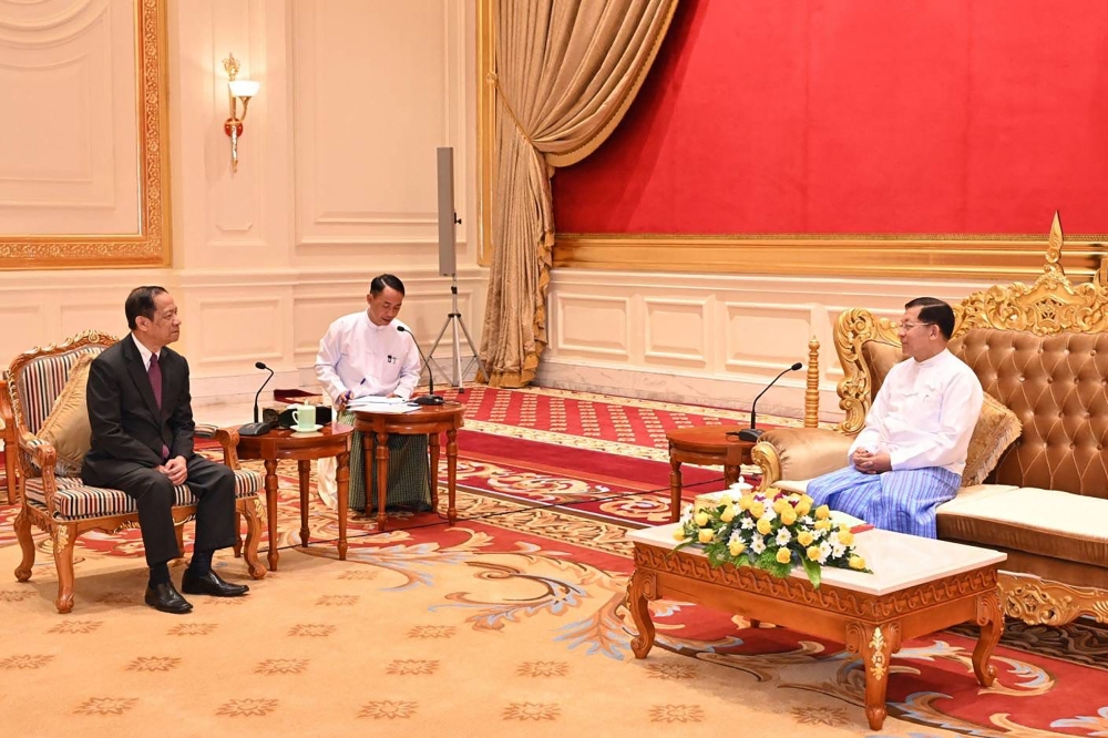 This handout photo taken and released on January 10, 2024 by the Myanmar Military Information Team shows Myanmar’s military chief Min Aung Hlaing (right) meeting with Alounkeo Kittikhoun, special envoy of the Asean chair on Myanmar, in Naypyidaw. — AFP pic