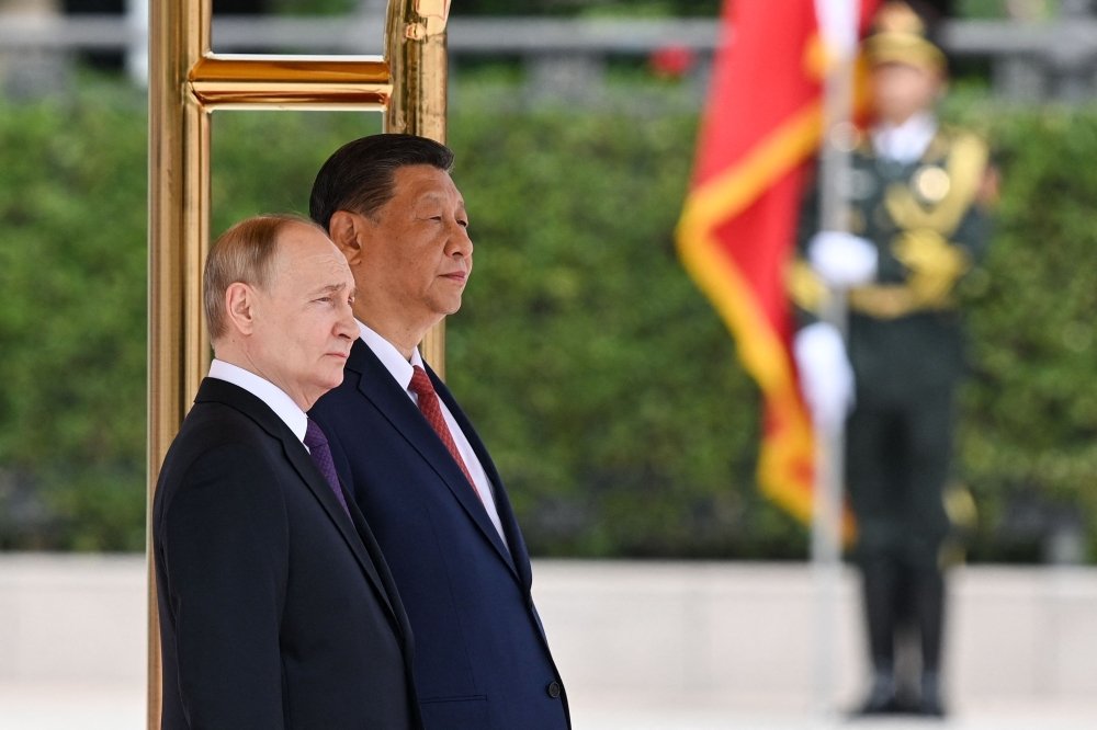 Leaders Xi Jinping and Vladimir Putin framed their nations’ ties as a stabilising force in a chaotic world as they met today in Beijing, where the Russian president is seeking greater Chinese support for his war effort in Ukraine and isolated economy. — AFP pic
