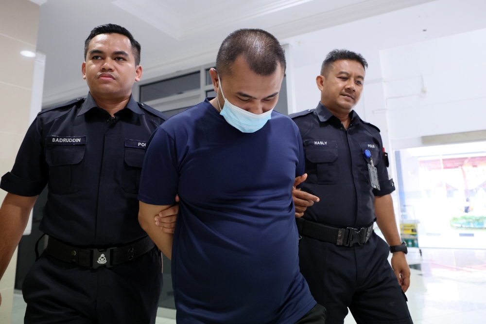 Muhammad Zairuzi Zahri, 31, was sentenced to nine years in prison and one stroke of the cane after being found guilty of robbing and physically assaulting a 19-year-old girl two years ago. — Bernama pic 