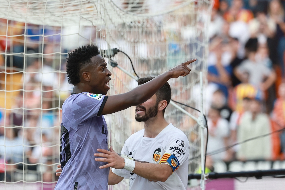 Real Madrid’s Brazilian forward Vinicius Junior reacts to being insulted pointing at the stands during the Spanish league football match between Valencia CF and Real Madrid CF at the Mestalla stadium in Valencia in this file picture dated May 21, 2023. — AFP pic