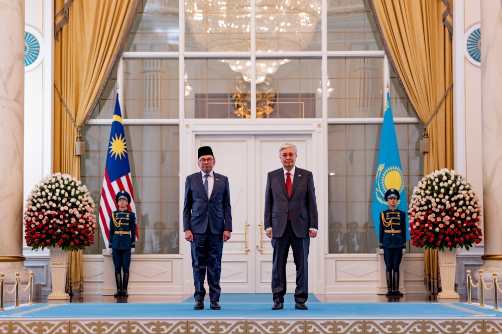 Prime Minister Datuk Seri Anwar Ibrahim and Kazakhstan President Kassym-Jomart pose for a picture during a meeting at the Presidential Palace in Astana May 16, 2024. — Bernama pic