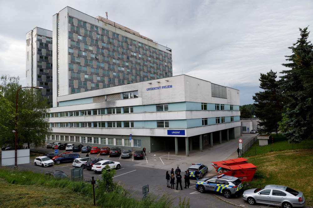 Police officers stand next to police vehicles outside the F.D. Roosevelt University Hospital where Slovak Prime Minister Robert Fico was taken after a shooting incident in Handlova, in Banska Bystrica, Slovakia, May 17, 2024. — Reuters pic