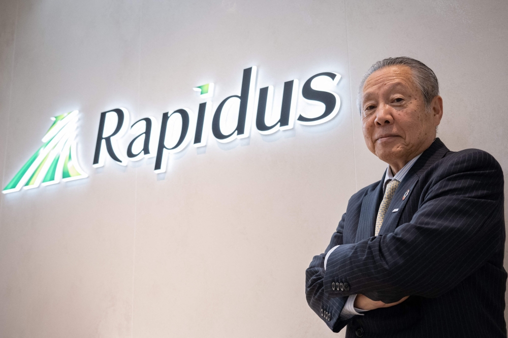 This picture taken on May 16, 2024 shows Tetsuro Higashi, chairman on the board of new Japanese semiconductor maker Rapidus Corporation, posing for photographs at company's headquarters in Tokyo. — AFP pic