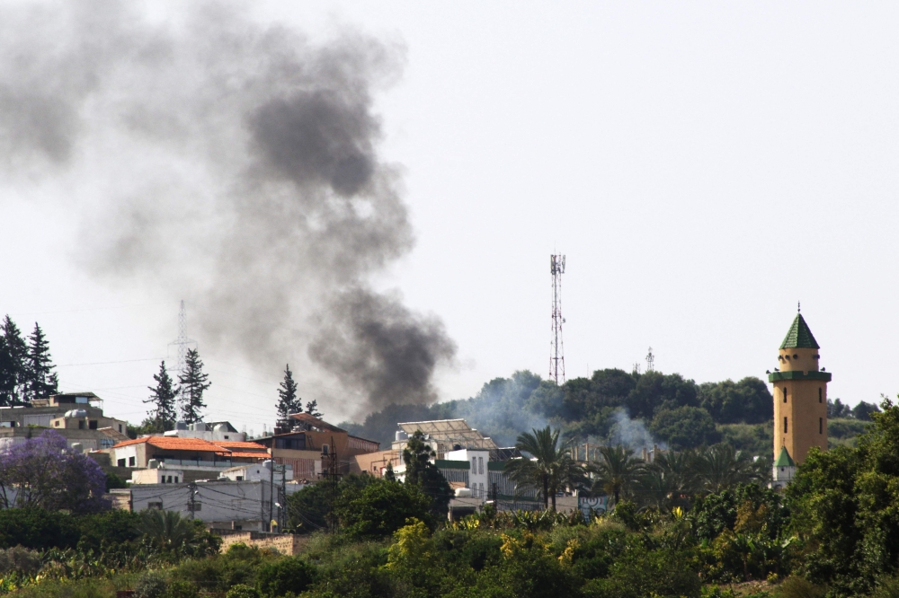 Smoke billows during Israeli bombardment over the Lebanese village of Al-Najjariyeh on May 17, 2024, in southern Lebanon near the border with Israel. — AFP pic