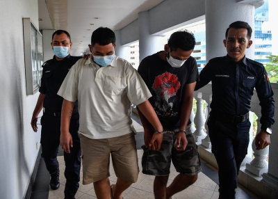 Another two men charged with throwing petrol bomb at entertainment centre on Jalan Yap Kwan Seng 