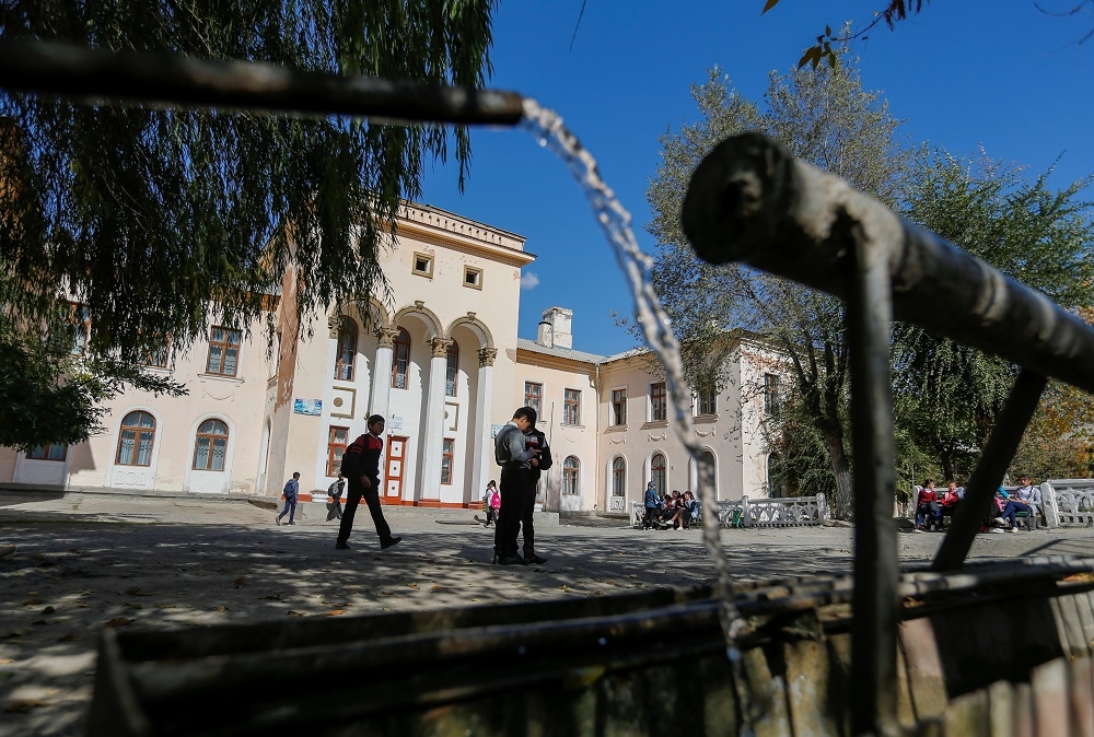 File photo of students seen in front of a school in the town of Mailuu-Suu, Kyrgyzstan October 23, 2019. — Reuters pic
