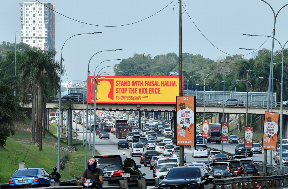 A billboard showing solidarity with Harimau Malaya and Selangor FC footballer Mohamad Faisal Abdul Halim is seen at the Federal Highway May 18, 2024. — Bernama pic