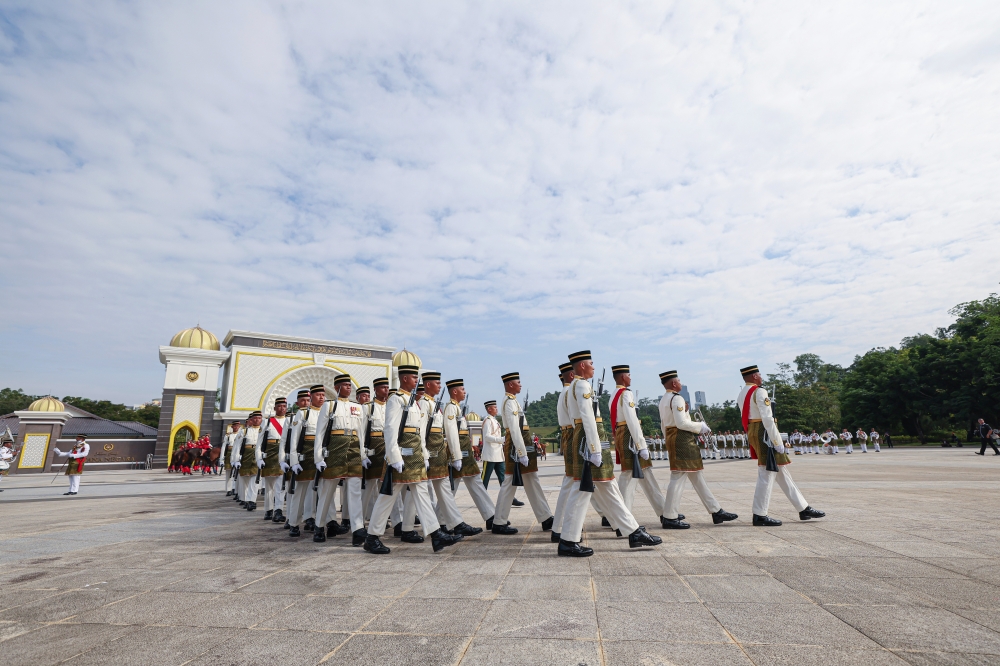 A total of 14 officers and 185 members from the 1st Battalion of the Royal Malay Regiment and the Cavalry Ceremonial Squadron of the Malaysian Armed Forces pose for a photo during the Changing of the Guard ceremony which took place at Gate I of Istana Negara May 18, 2024. — Bernama pic