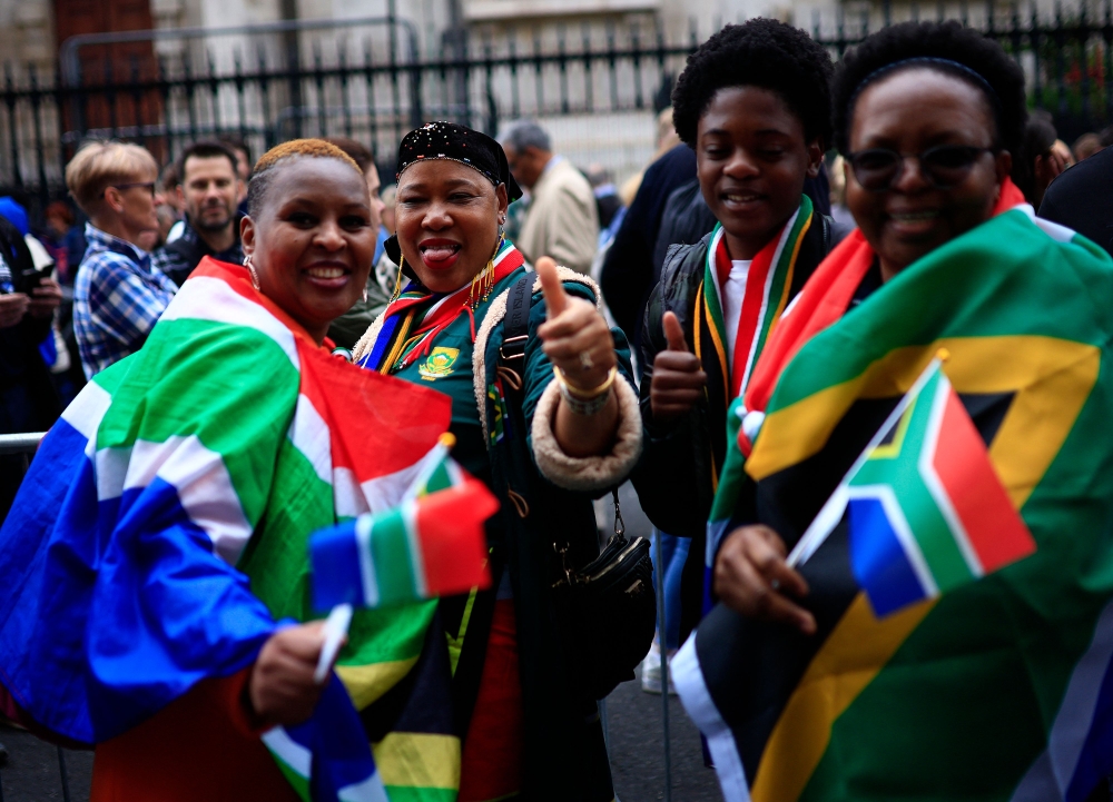 People queue outside of the South African High Commission in central London on May 18, 2024, to vote in South Africa’s forthcoming general election. — AFP pic