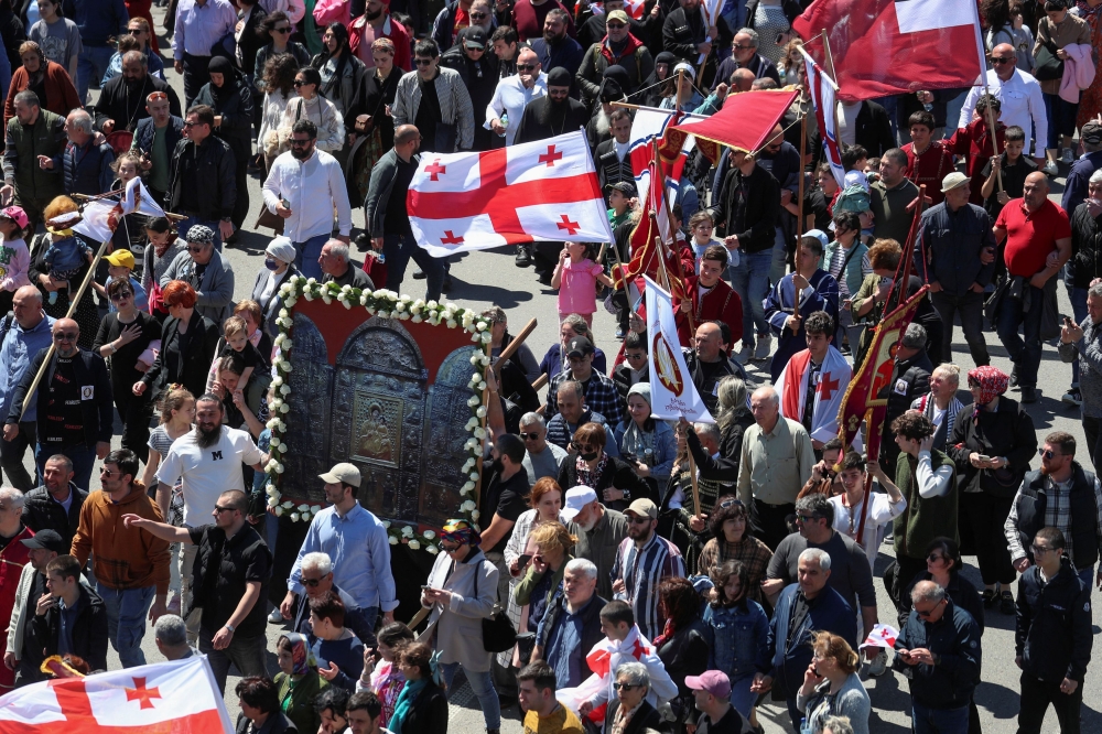 People take part in a procession, that was organised by the Patriarchate of Georgia’s Orthodox Church to mark the Day of Family Purity and Respect for Parents, in Tbilisi, Georgia, May 17, 2024. — Reuters pic
