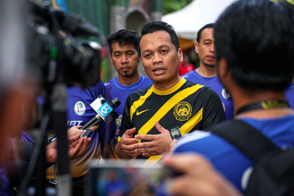 Natural Resources and Environmental Sustainability Minister Nik Nazmi Nik Ahmad speaks to reporters after a visit to the Kuala Lumpur Forest Eco Park in Bukit Nanas today. — Bernama pic