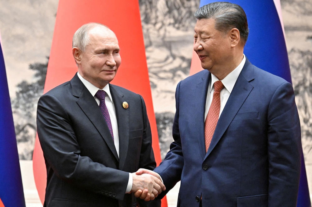 On Thursday, the Russian and Chinese leaders pledged a 'new era' of partnership between the two most powerful rivals of the United States. — Reuters pool pic