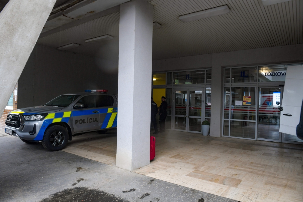 Police guarding the hospital in Banska Bystrica, Slovakia where Slovak Prime Minister Robert Fico is being treated. — AFP pic