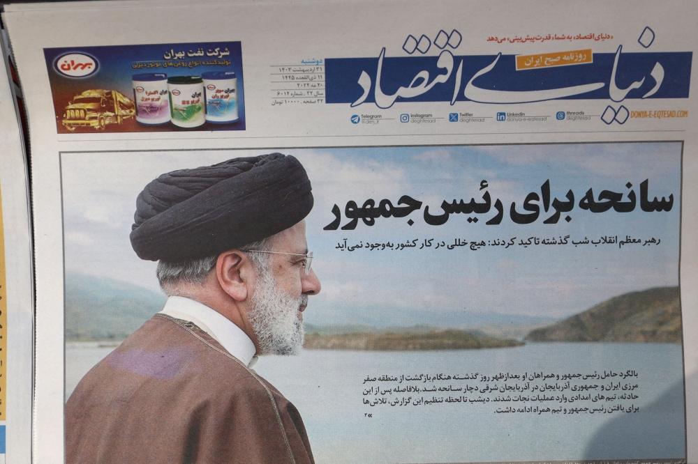 A newspaper with a picture of the late Iranian President Ebrahim Raisi is seen in Tehran, Iran May 20, 2024. — Majid Asgaripour/WANA (West Asia News Agency) handout pic via Reuters   