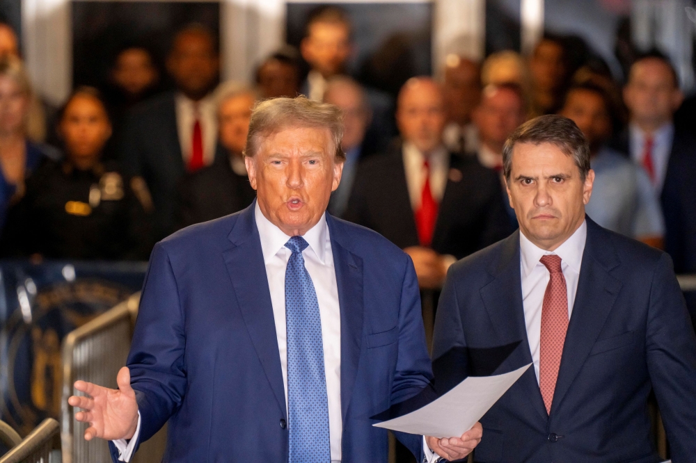 Former President Donald Trump talks to the Press Pool on the day of trial at the Manhattan Criminal Court in New York City May 20, 2024. — Pool via Reuters