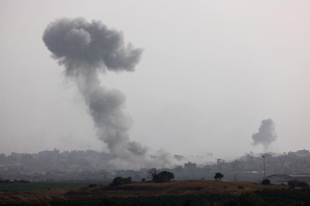 Smoke rises from an explosion following an airstrike in Gaza, amid the ongoing conflict between Israel and the Palestinian Islamist group Hamas, near the Israel-Gaza border, as seen from Israel, May 20, 2024. — Reuters pic