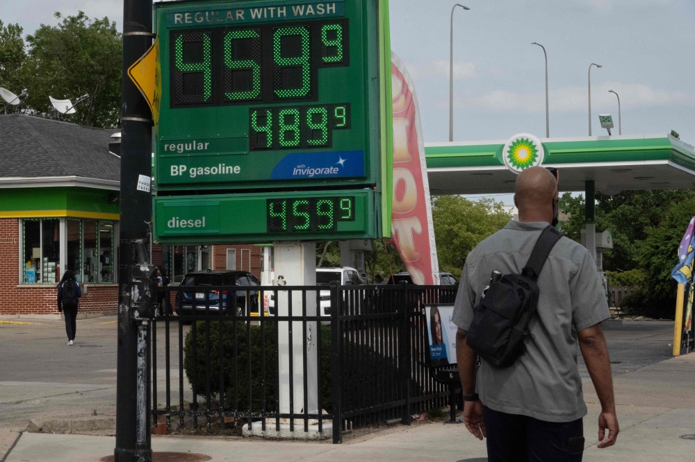 A sign displays gas prices at a gas station on May 21, 2024 in Chicago, Illinois. President Joe Biden has said he will release 1 million barrels of gasoline from the strategic reserve to help reduce prices ahead of the July 4th holiday and summer driving season. — Scott Olson/Getty Images/AFP pic