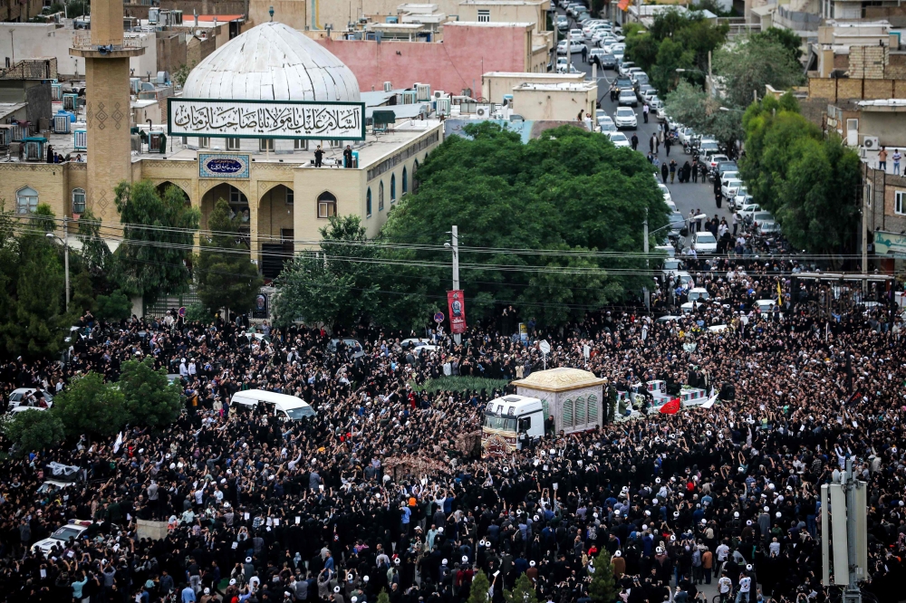 Mourners attend the funeral procession of Iran’s President Ebrahim Raisi at a Muslim Shiite Shrine in Qom on May 21, 2024. — AFP pic