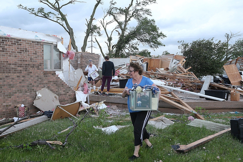 Volunteers clean up after a tornado touched down in Nevada, Iowa. — Reuters pic/Nirmalendu Majumdar/Ames Tribune/USA Today Network