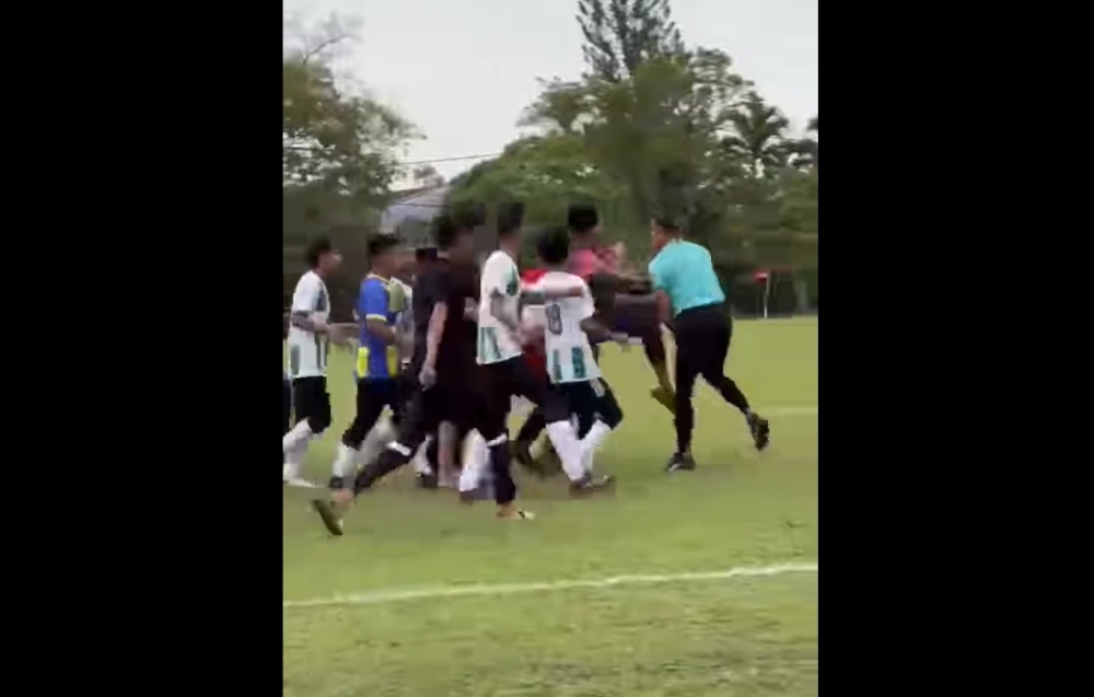 A video clip that went viral on social media showed players from both sides clashing against each other before one of the players, a student, pushed the referee from the back. — Screengrab from social media 
