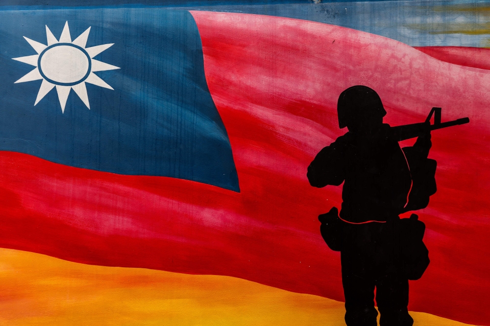 A painting of Taiwan’s national flag and a soldier is seen at Yangzhai Old Street in Kinmen. — AFP pic