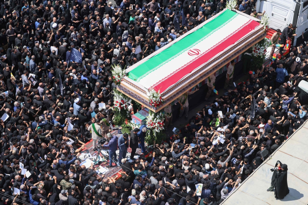 Mourners attend the funeral of Iran’s President Ebrahim Raisi, in Tehran on May 22, 2024. — AFP pic