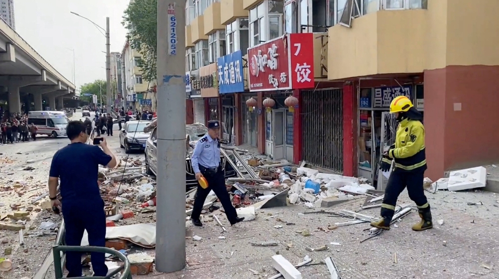 A suspected gas explosion at a residential building in China’s northeastern city of Harbin killed one person and injured three as it tore off a balcony, state media said today, while scattering rubble in the street. — Reuters pic