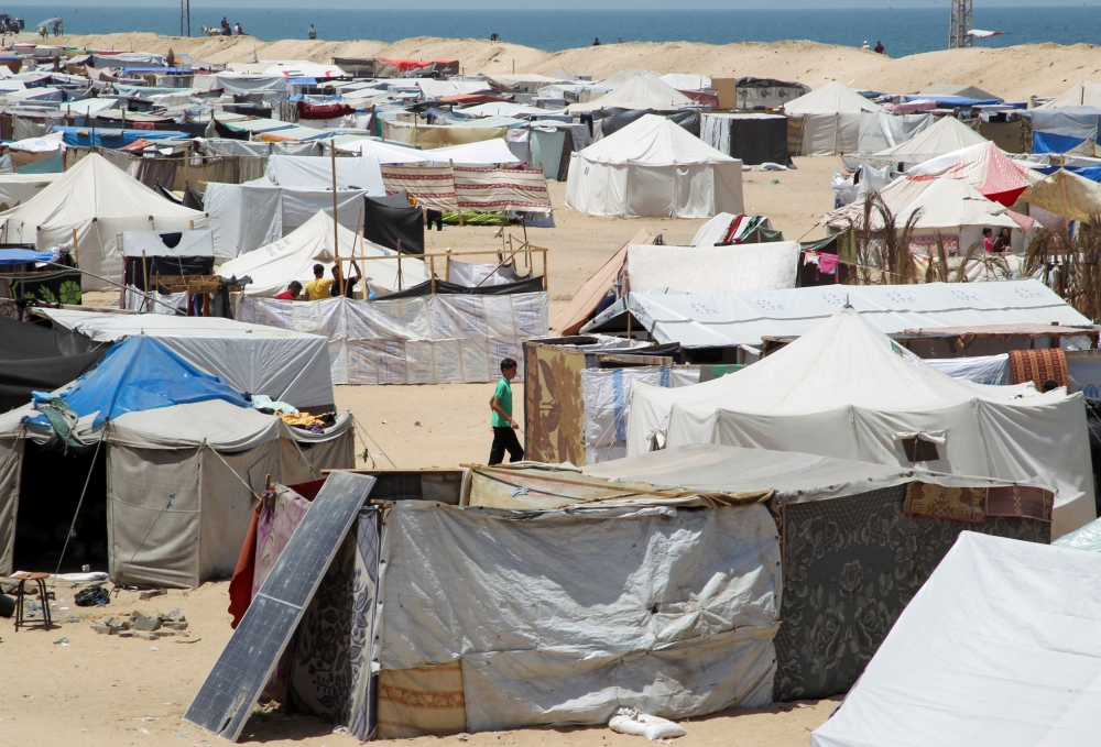 Displaced Palestinians, who fled their house due to Israeli strikes, shelter at a tent camp, amid the ongoing conflict between Israel and the Palestinian Islamist group Hamas, in the Al-Mawasi area in Rafah, in the southern Gaza Strip, May 22, 2024. — Reuters pic