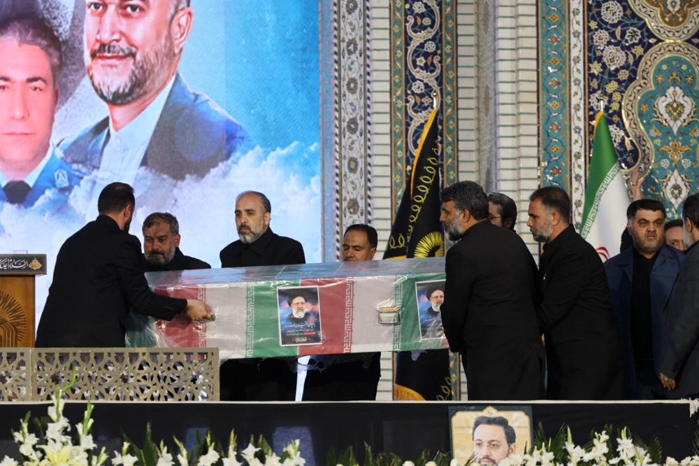 Iranians carry the coffin of late president Ebrahim Raisi at the Imam Reza shrine during the funeral ceremony in the city of Mashhad on May 23, 2024. — AFP pic