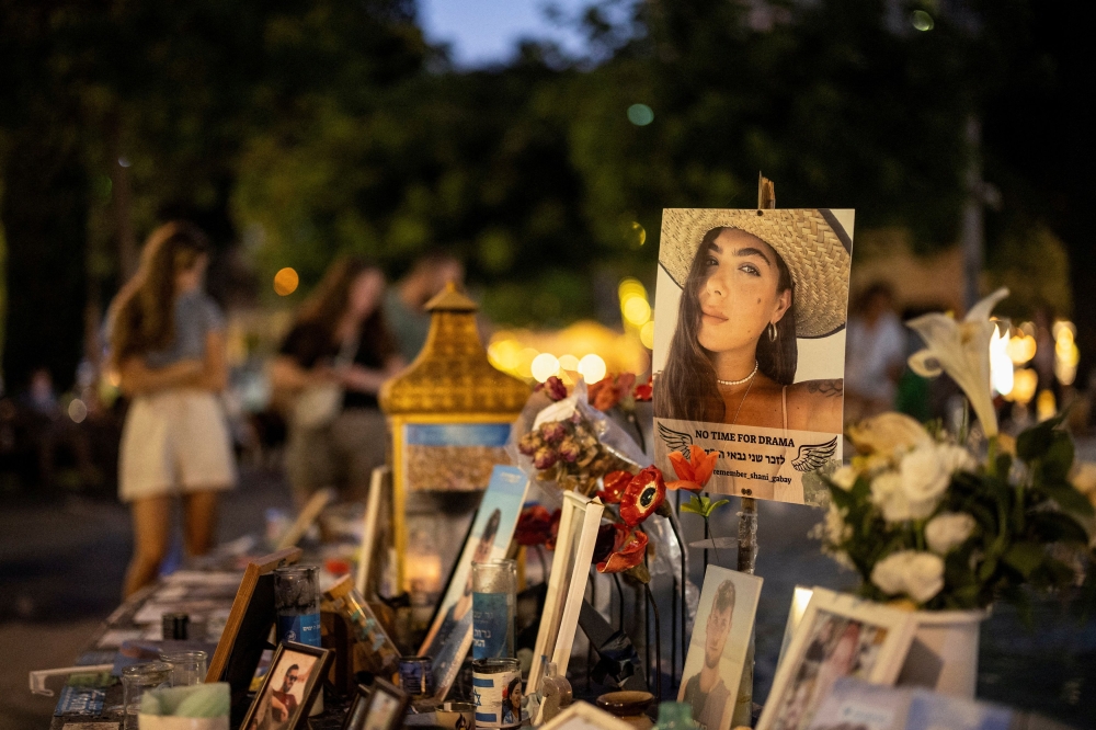 Memorabilia and pictures of the hostages kidnapped in the deadly October 7 attack on Israel by the Palestinian Islamist group Hamas cover a fountain at Dizengoff Square in Tel Aviv May 23, 2024. — Reuters pic  