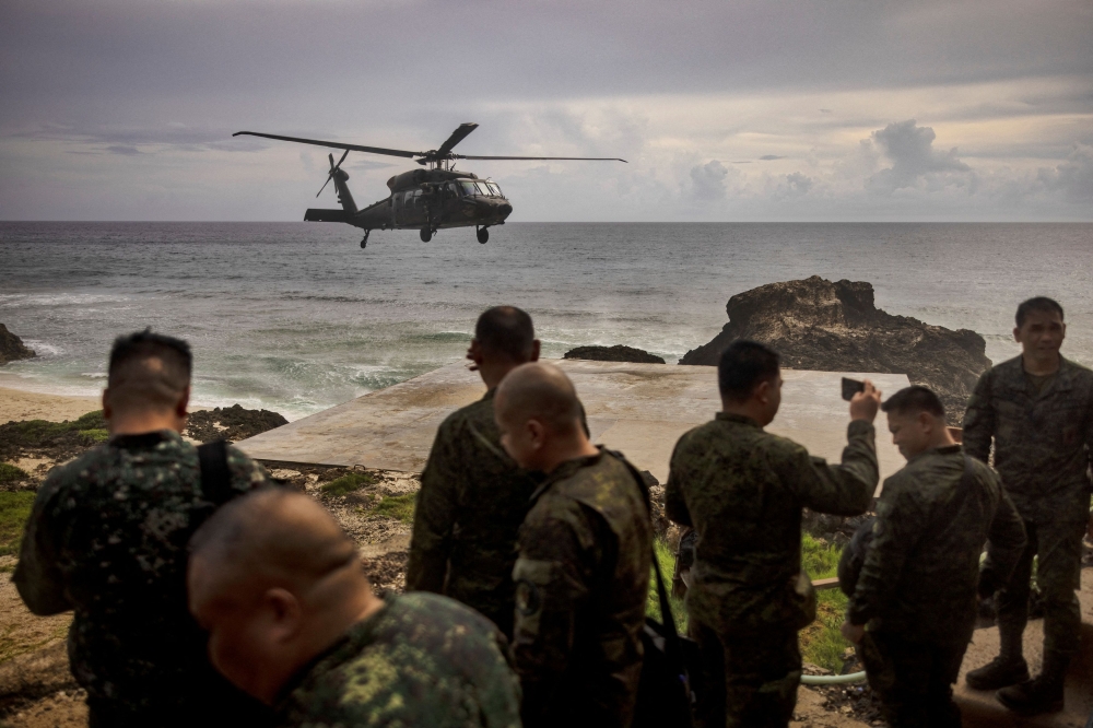 A Philippine Air Force Black Hawk helicopter lands on Mavulis Island during a trip of the chief of staff of the Armed Forces of the Philippines, in Batanes, Philippines June 29, 2023. — Ezra Acayan/Pool/Reuters pic