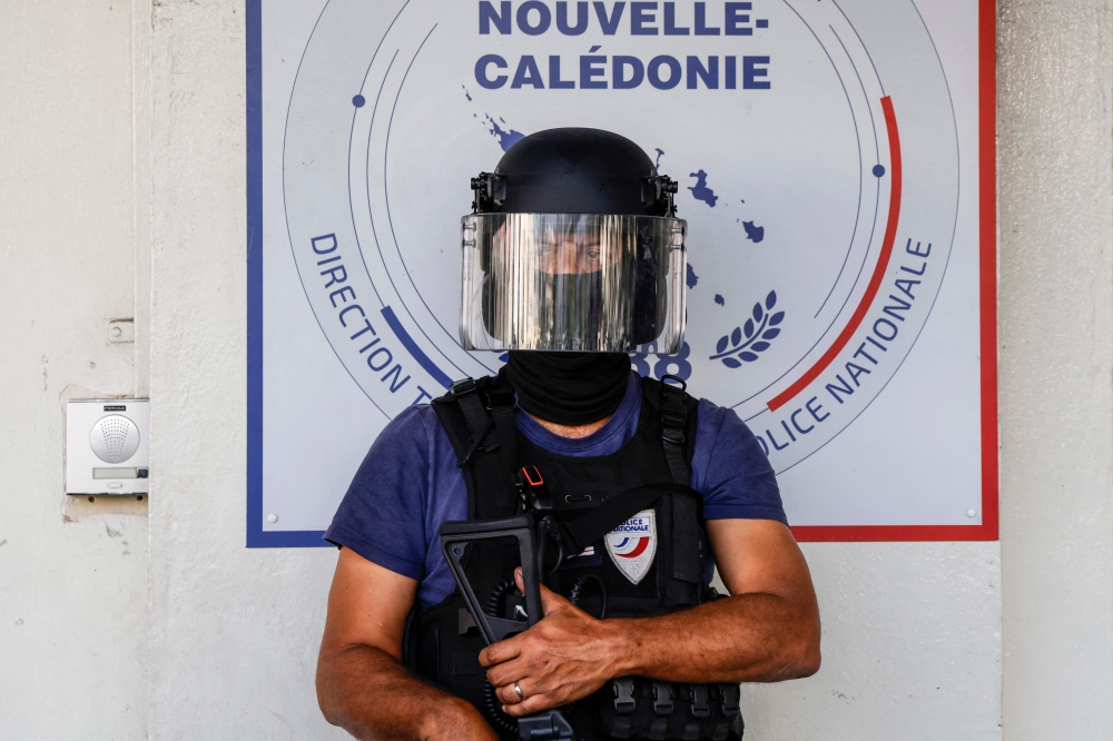 A policeman waits for the arrival of French President Emmanuel Macron at the central police station in Noumea, France's Pacific territory of New Caledonia May 23, 2024. — Ludovic Marin/Pool/AFP pic 