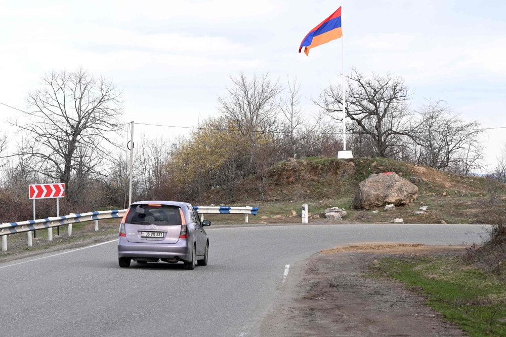 An Armenian flag sits on a roadside outside the village of Voskepar (Azerbaijani name is Ashaghi Askipara) in northeastern Armenia on March 27, 2024. Armenia today returned to Azerbaijan four border villages it had seized decades ago, officials in Yerevan and Baku said, a new step towards normalising ties between the historic rivals. — AFP pic