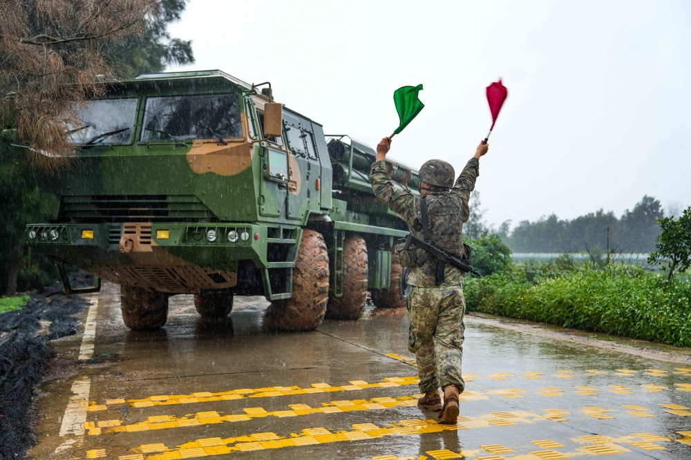 This handout photograph taken on May 23, 2024 and released on May 24, 2024 by the Eastern Theatre Command of China’s People’s Liberation Army (PLA) shows a soldier leading a Chinese rocket launcher at a base during the ;Joint Sword-2024A’ military drill in eastern China’s Fujian province. — Picture by Eastern Theatre Command Of The People’s Liberation Army via AFP