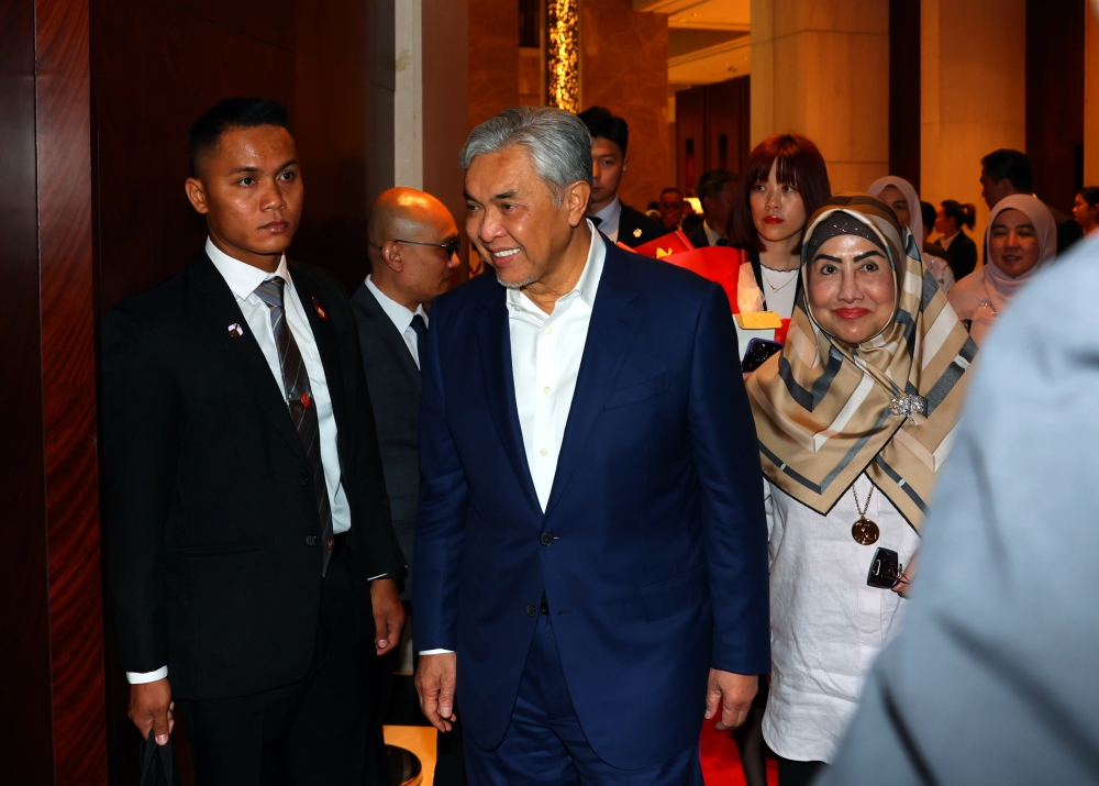 Deputy Prime Minister Datuk Seri Ahmad Zahid Hamidi and his wife, Datin Seri Hamidah Khamis, arrive in Shanghai May 25, 2024. — Bernama pic