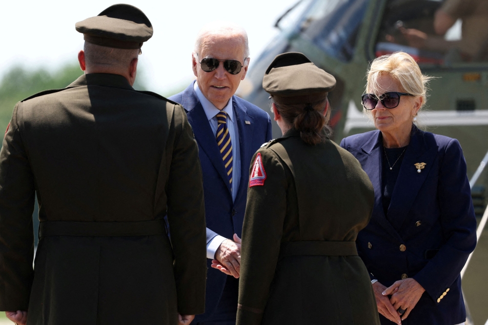 File photo of President Joe Biden and first lady Jill Biden being greeted by military officials outside Marine One at Delaware Air National Guard Base in New Castle, Delaware, US, May 24, 2024. — Reuters pic