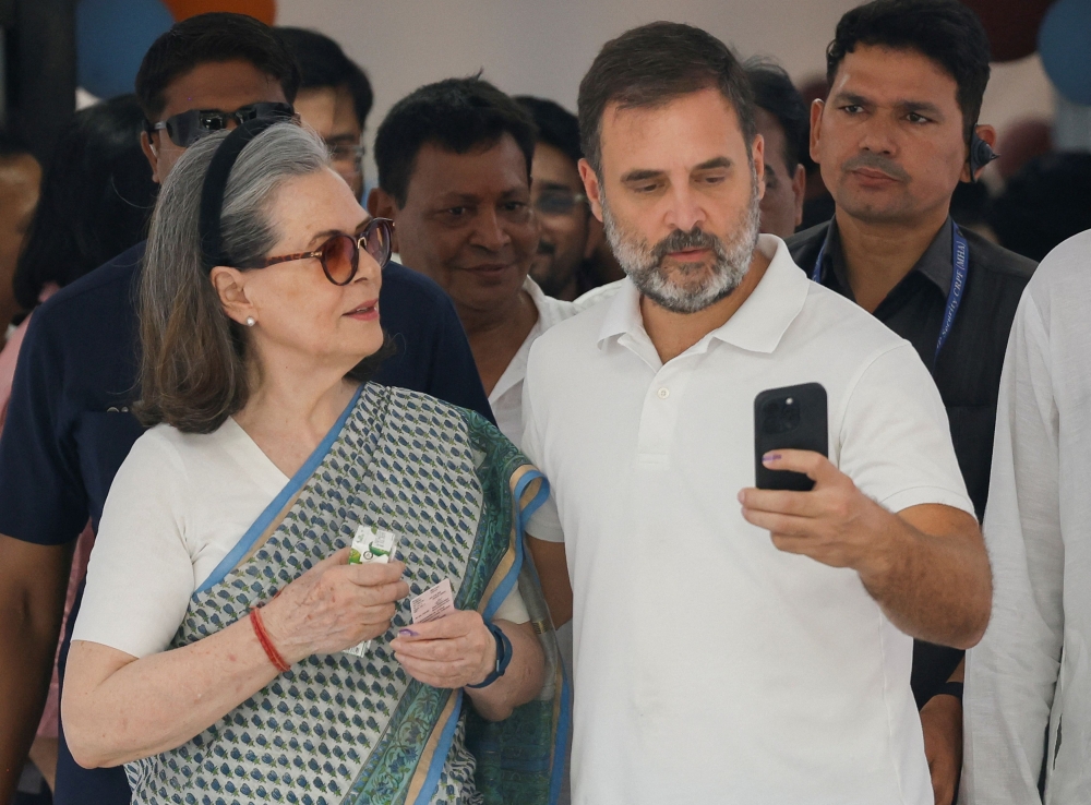 Rahul Gandhi and Sonia Gandhi, senior leaders of India’s main opposition, the Congress party, take a selfie at a polling station during the sixth phase of the general election, in New Delhi, India May 25, 2024. — Reuters pic