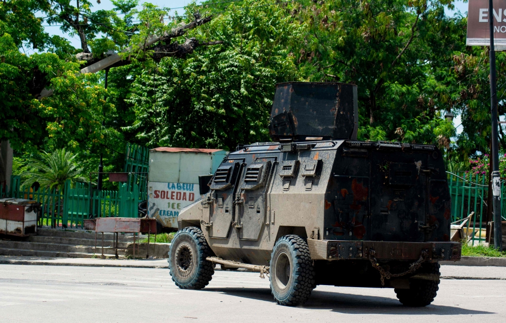 A police tank patrols the area where armed gangs have spread terror, in Port-au-Prince, Haiti, on May 24, 2024. — AFP pic