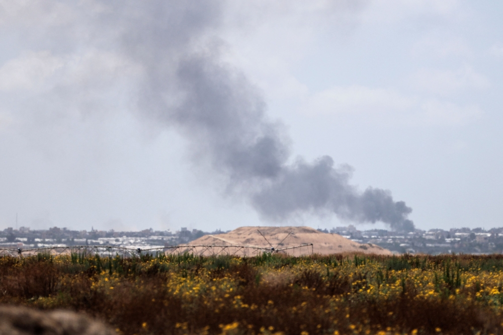 Smoke rises following an airstrike in Gaza, amid the ongoing conflict between Israel and the Palestinian Islamist group Hamas, near the Israel-Gaza border, as seen from Israel, May 25, 2024. — Reuters pic