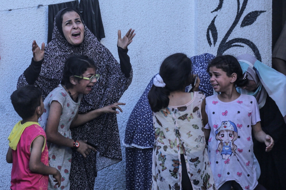 Amnesty International today urged the International Criminal Court to investigate as war crimes three recent Israeli strikes that killed 44 Palestinian civilians, including 32 children. — AFP pic